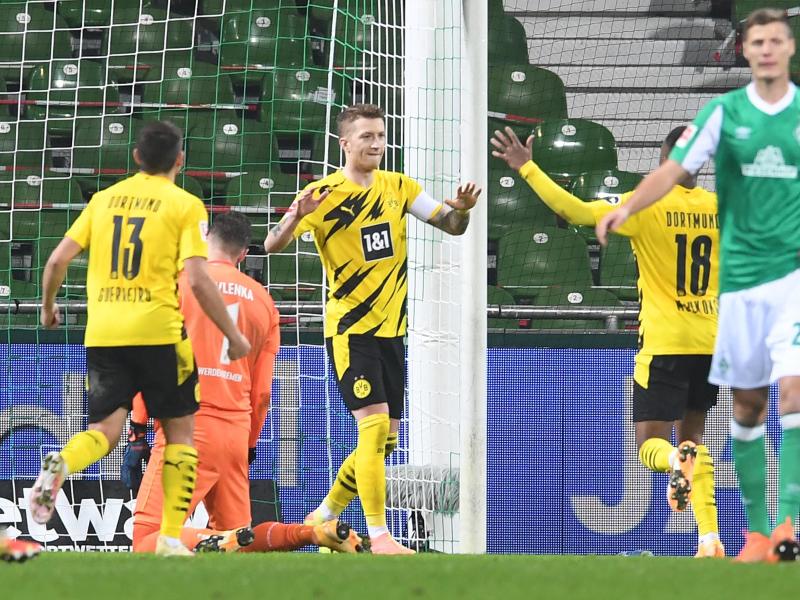 BVB-Kapitän Marco Reus (M) sorgte für den Dortmunder Sieg in Bremen. Foto: Carmen Jaspersen/dpa