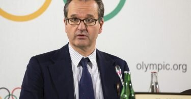 IOC-Sprecher Mark Adams spricht auf einer Pressekonferenz. Foto: Cyril Zingaro/KEYSTONE/dpa/Archivbild