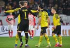 Die Spieler von Borussia Dortmund feiern den Rumpelsieg beim FSV Mainz 05. Foto: Torsten Silz/dpa